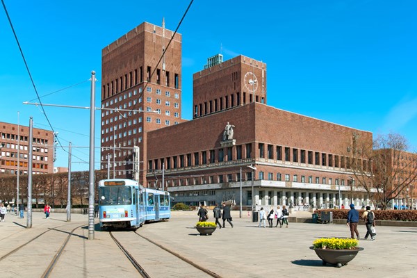 People and tram near the Oslo City Hall