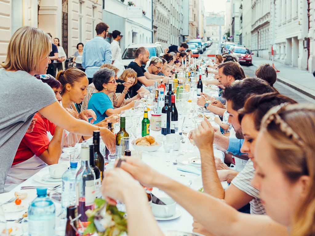 Dining with neighbours in the street